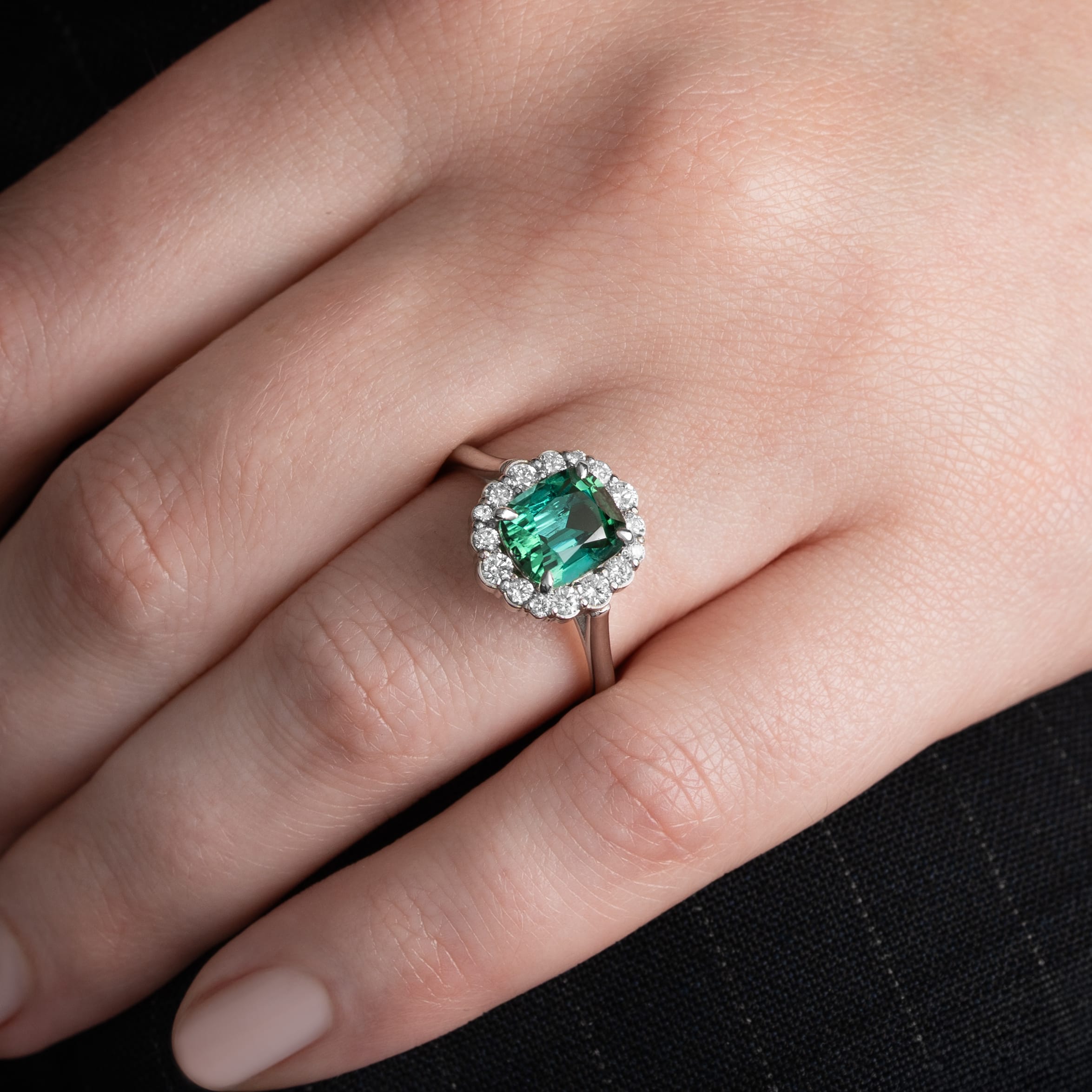 Cushion lagoon tourmaline and diamond halo ring
