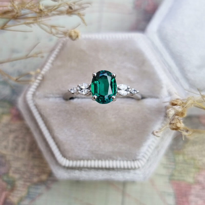 Lab grown oval emerald and marquise diamond ring product image