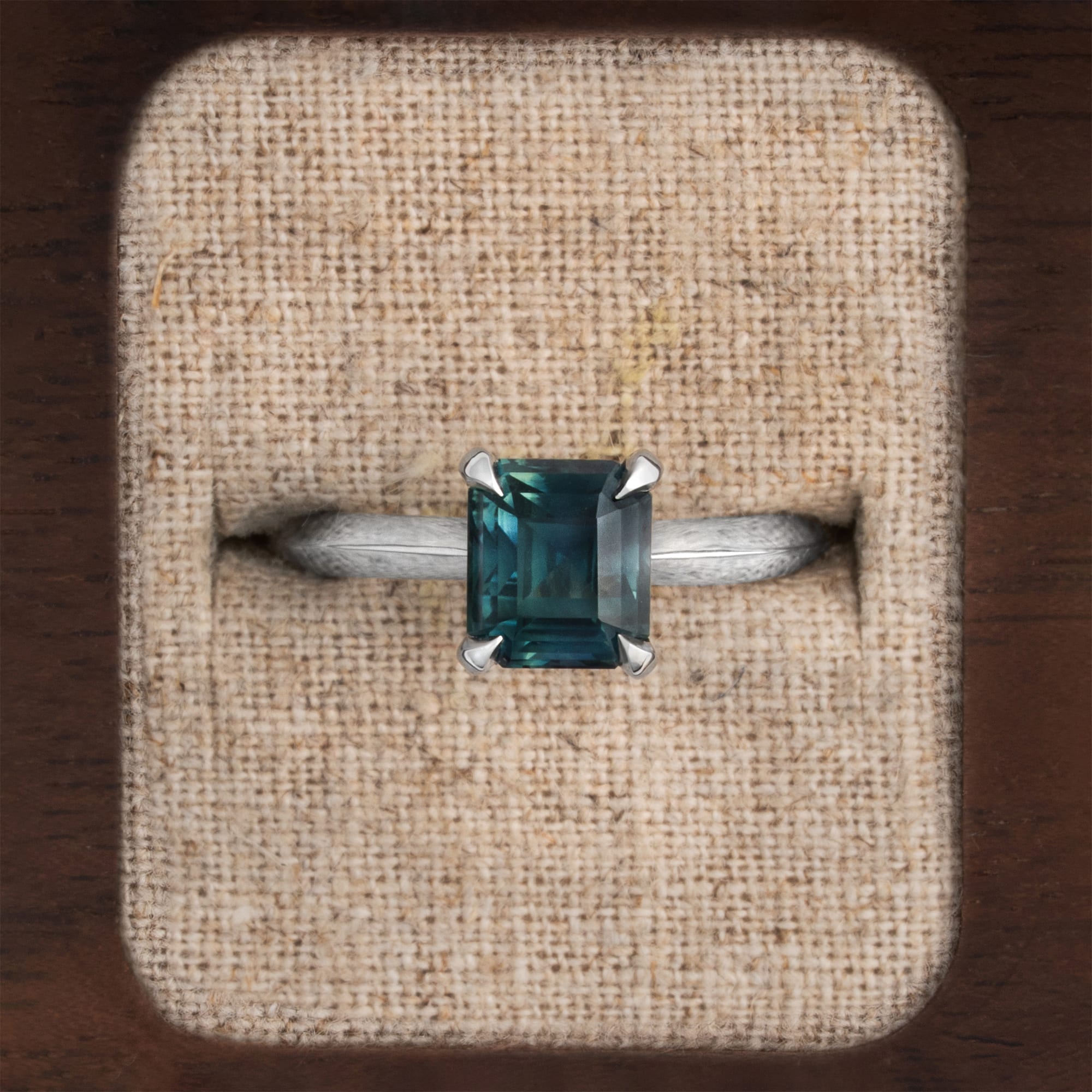 Emerald cut teal sapphire solitaire ring