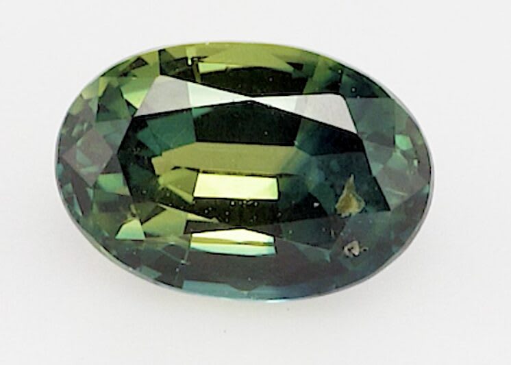 0.65ct oval green and yellow sapphire product image