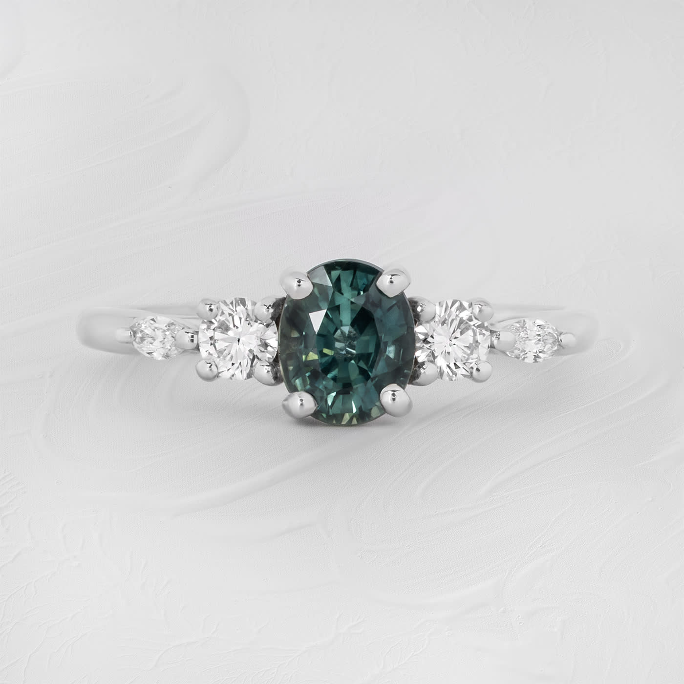 Oval teal sapphire and diamond trellis ring  product image