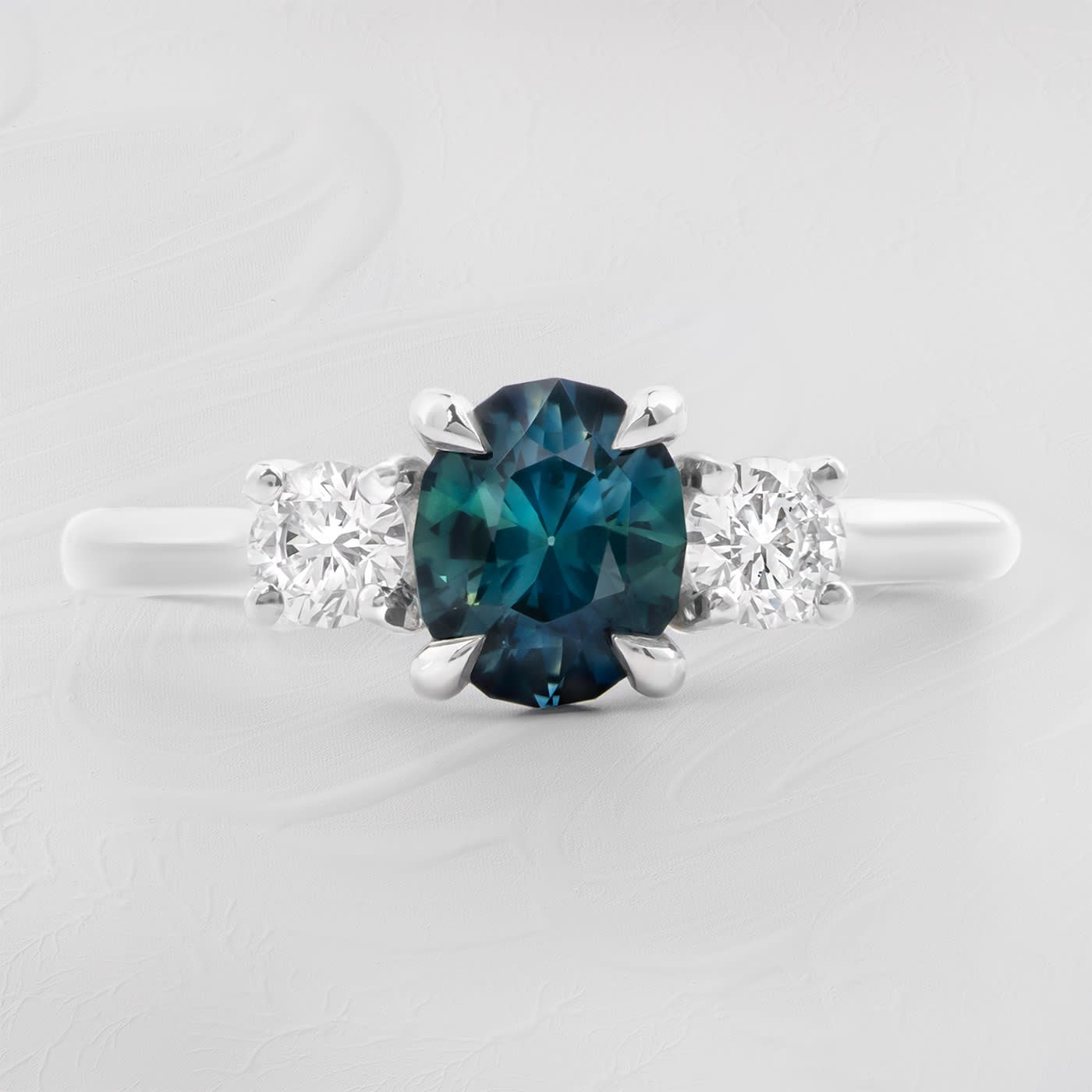 Precision teal sapphire and diamond ring product image