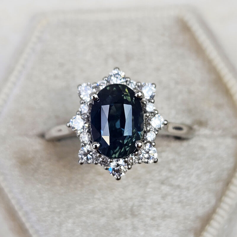 Deep smoky teal sapphire and diamond halo ring product image