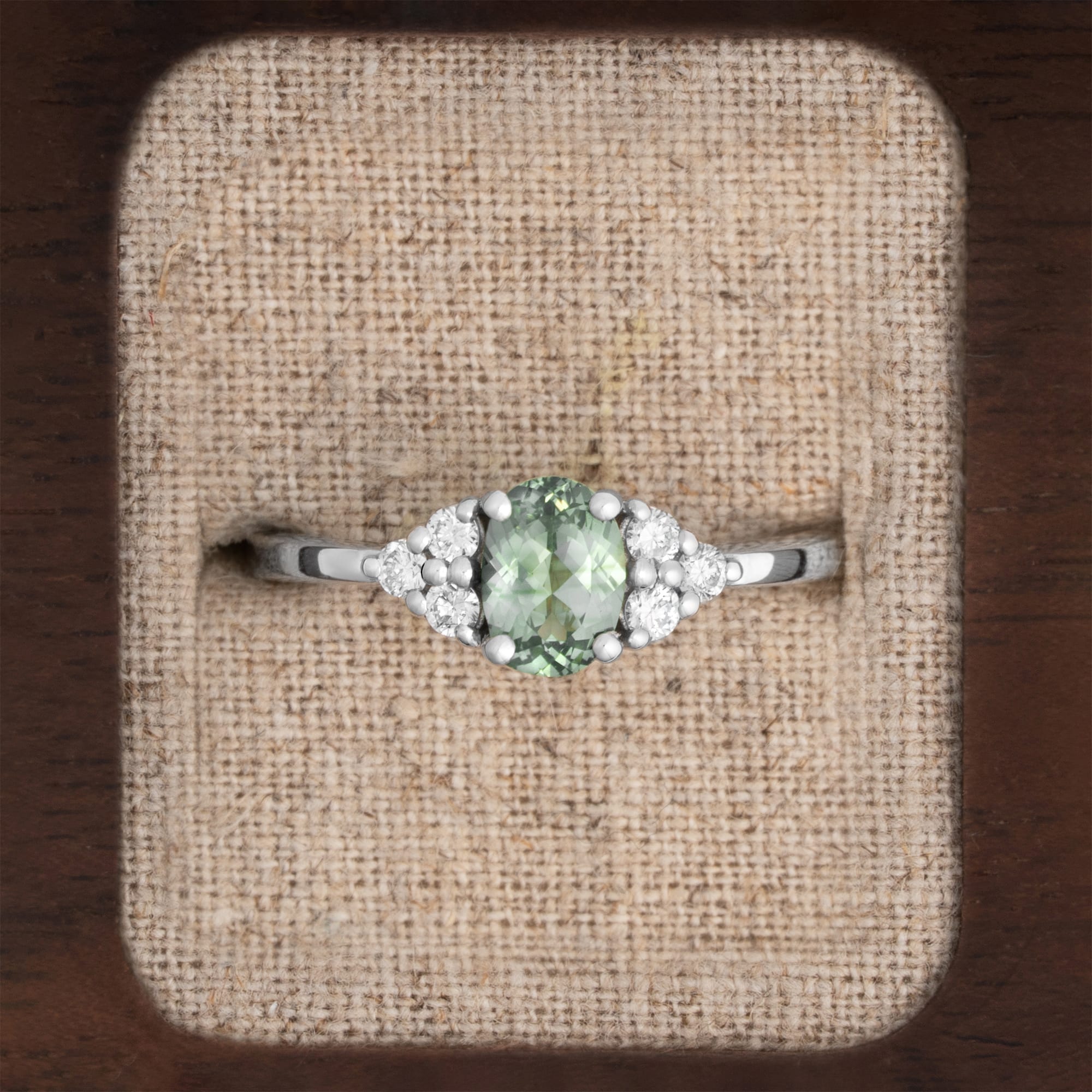 Oval lab grown seafoam green sapphire and diamond ring