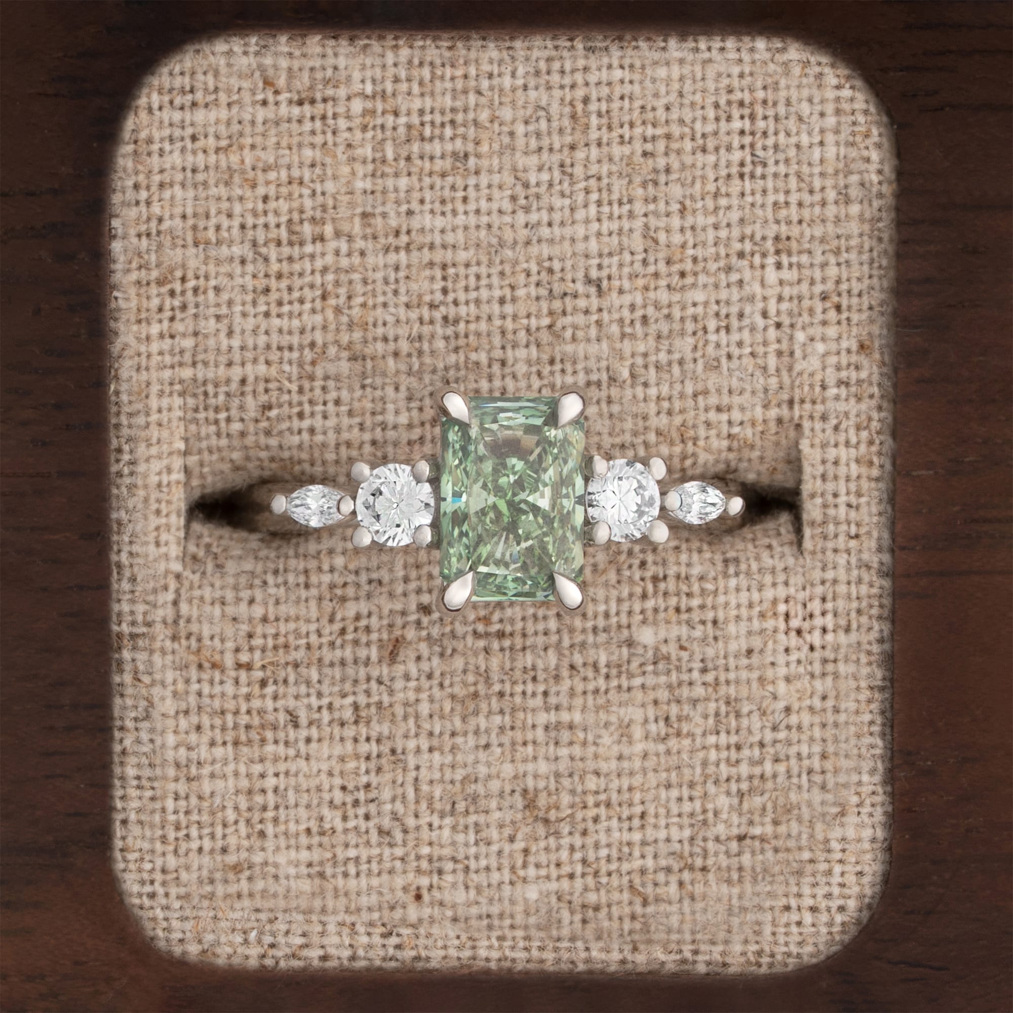 Radiant green diamond trellis ring 