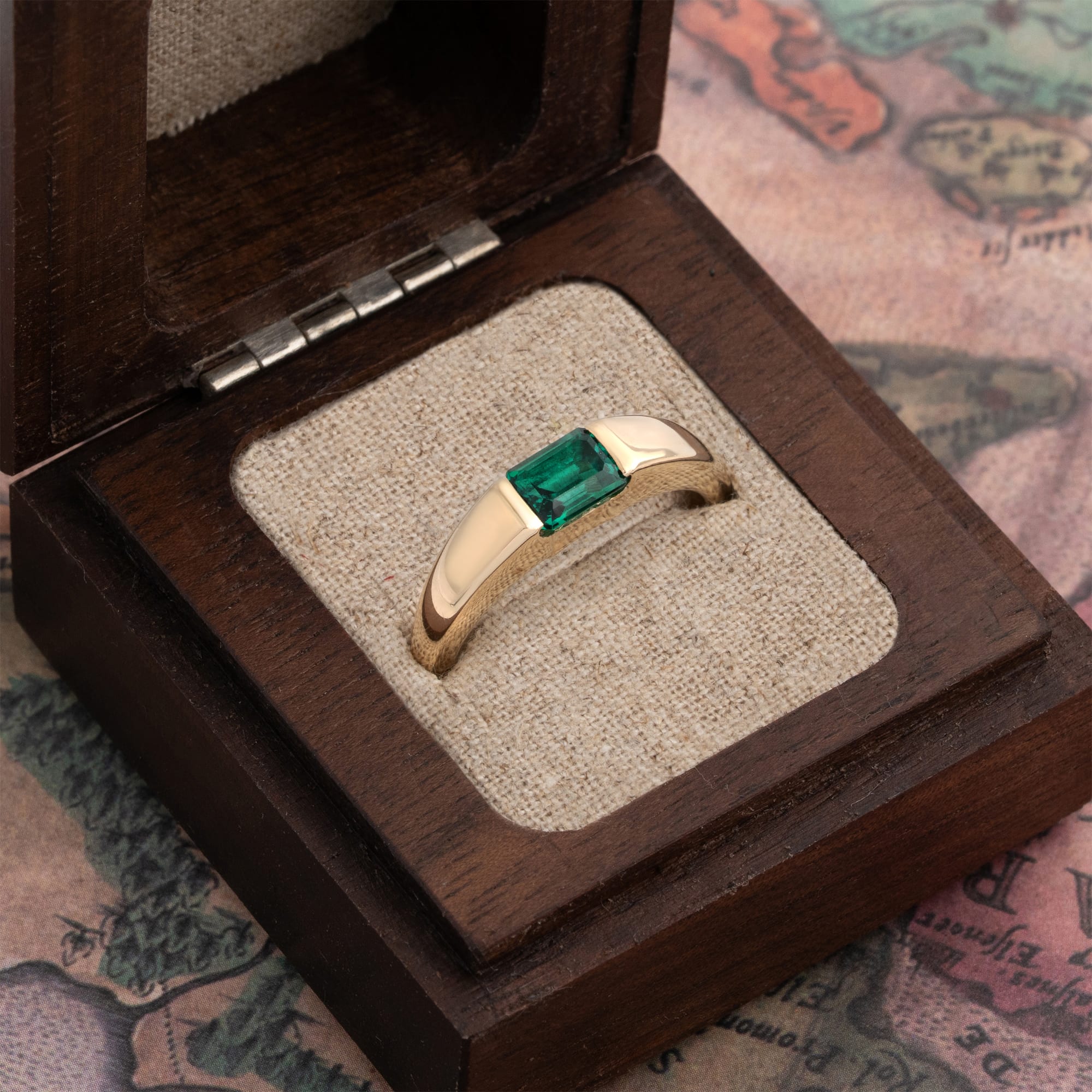 Channel set emerald tapered band — 3