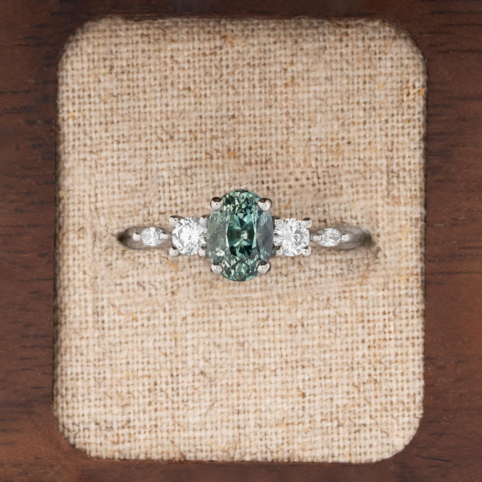 Oval teal sapphire and diamond trellis ring  product image