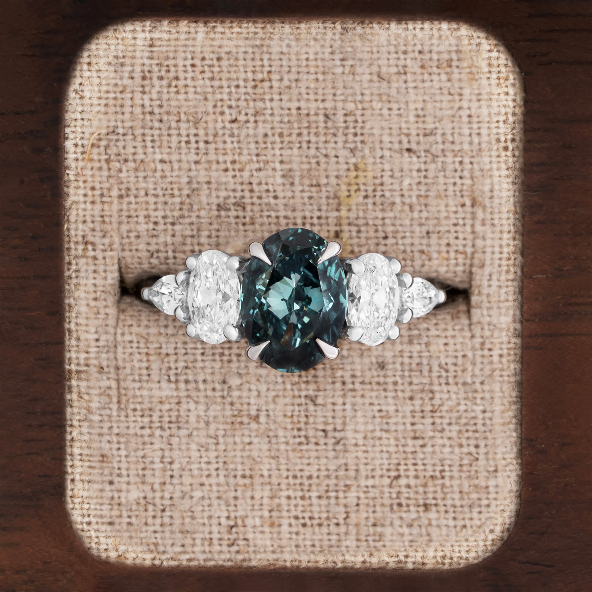 Oval dark teal diamond ring