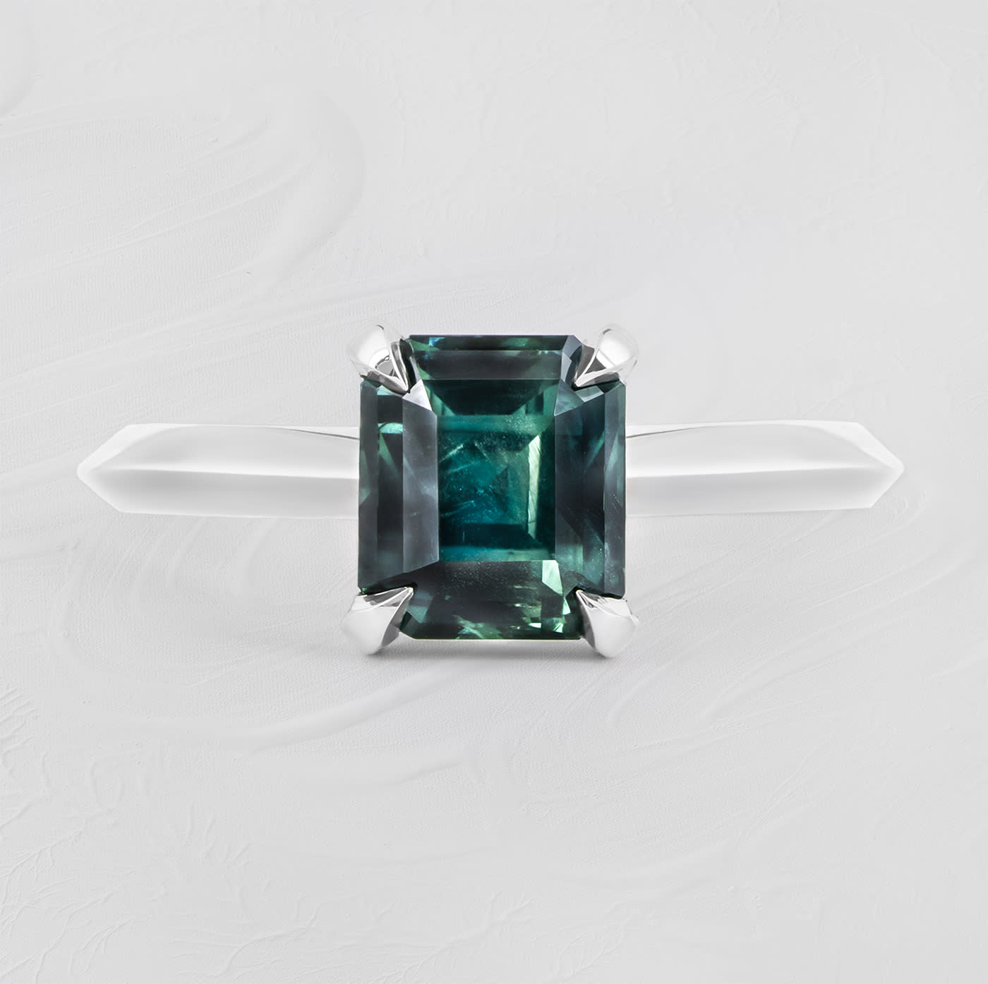 Emerald cut teal sapphire solitaire ring product image