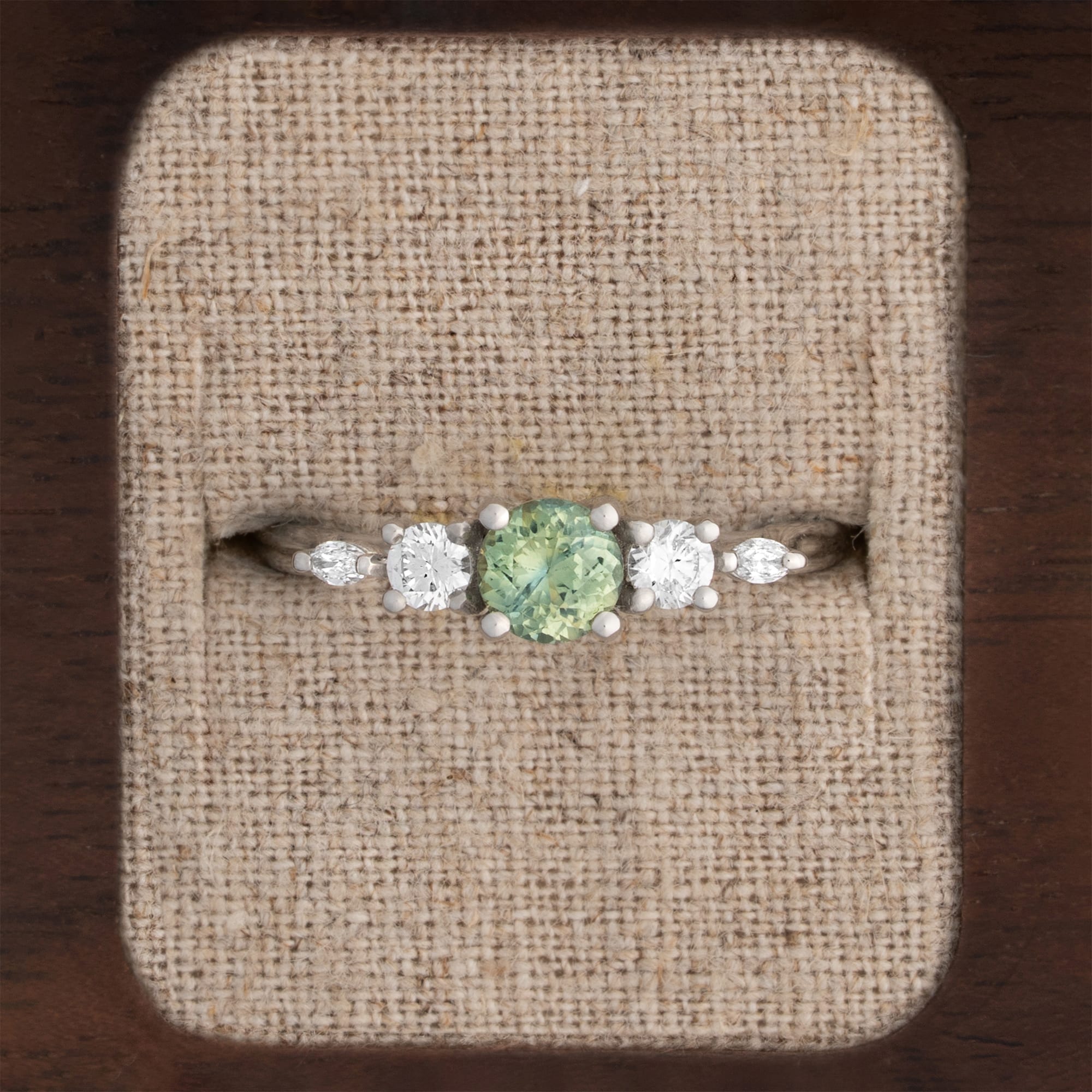 Precision cut green sapphire and diamond trellis ring 