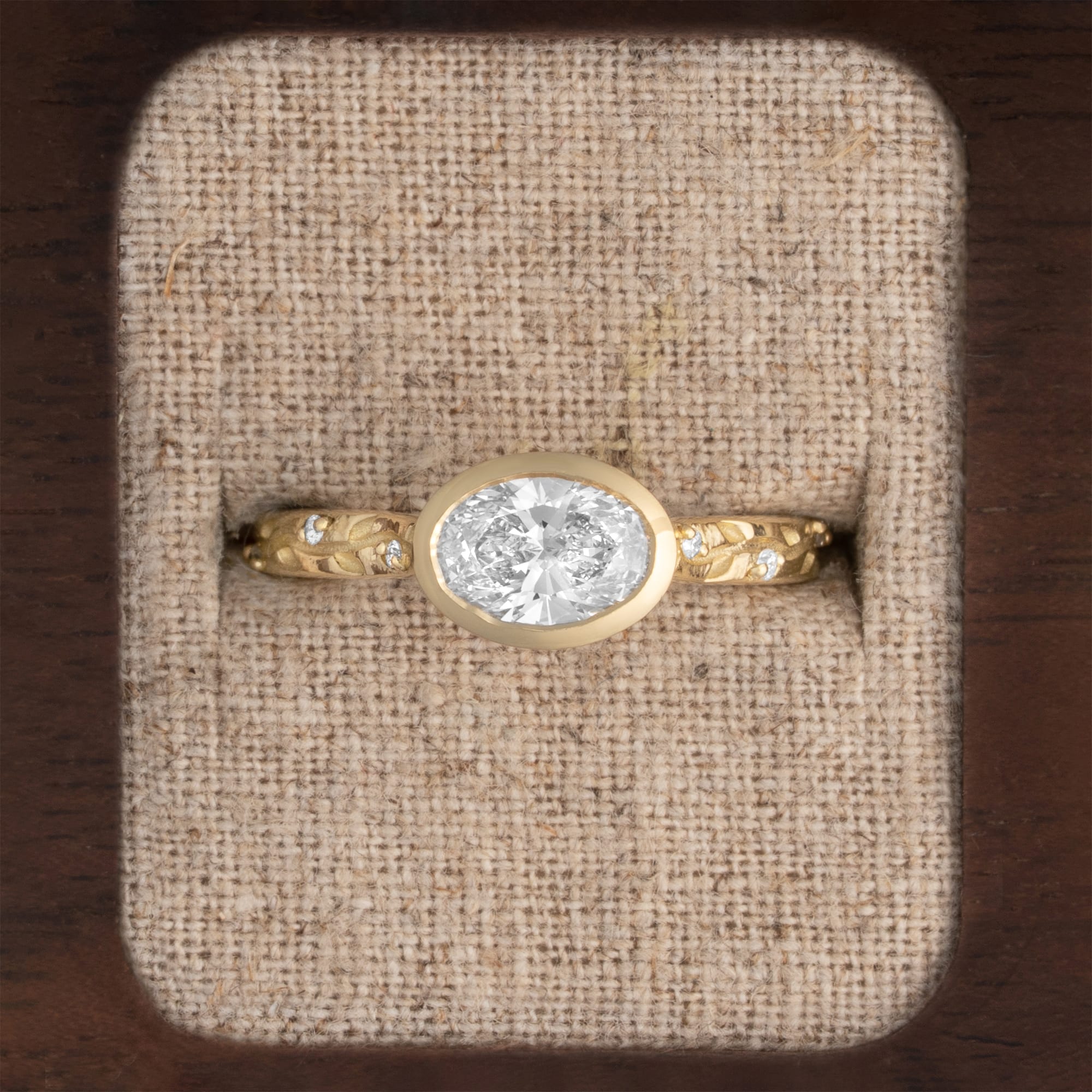 Oval bezel set vine engraved lab diamond ring 