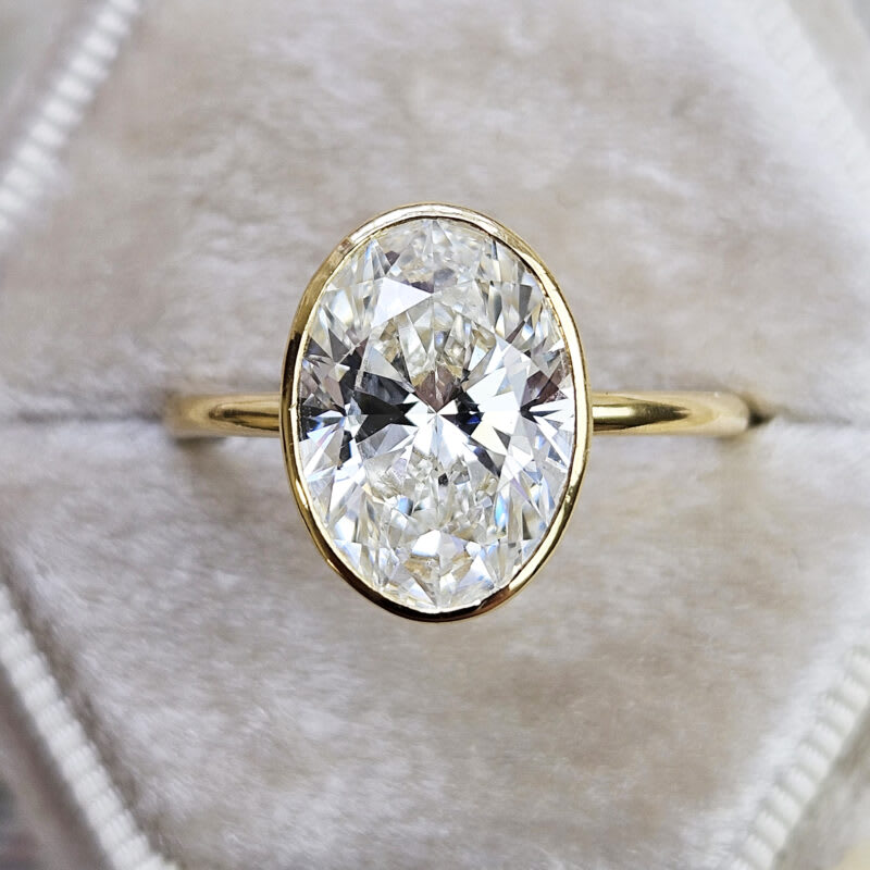 Oval lab grown diamond solitaire ring in 18ct yellow gold product image
