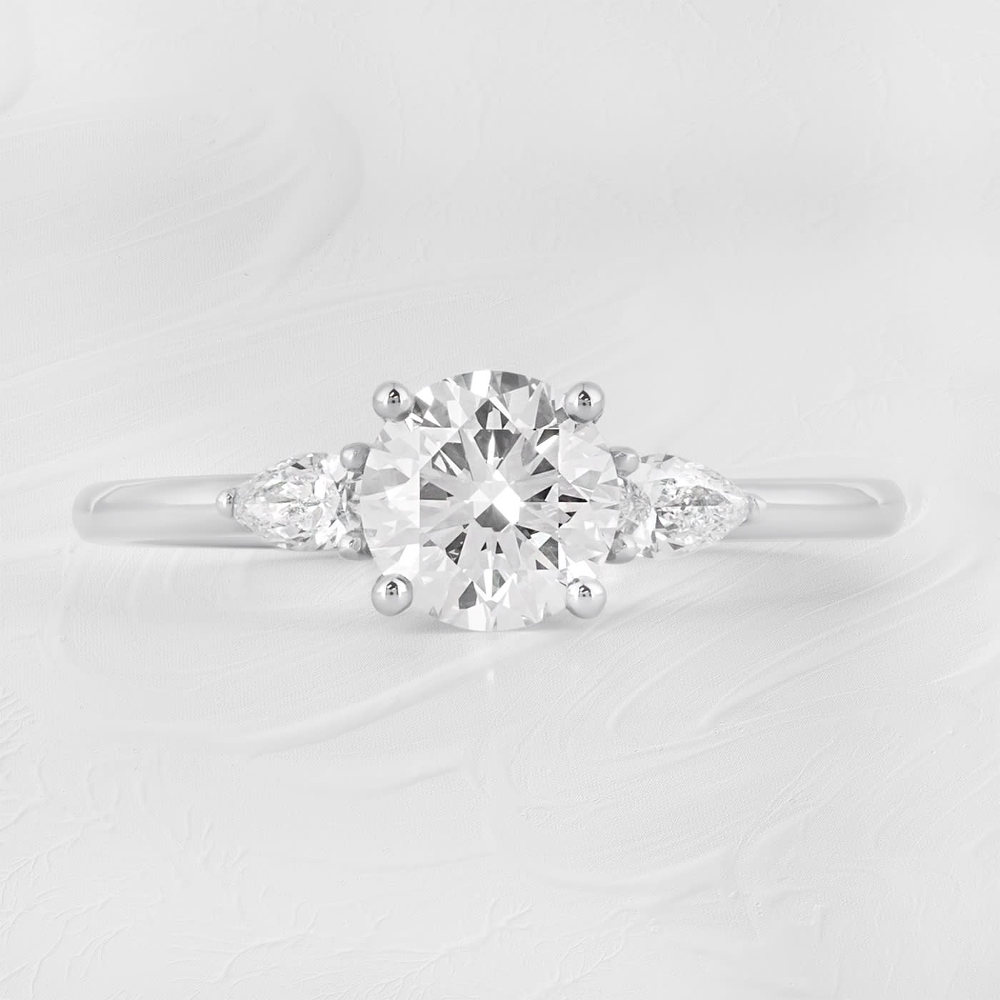 Round and pear lab grown diamond trilogy ring  product image