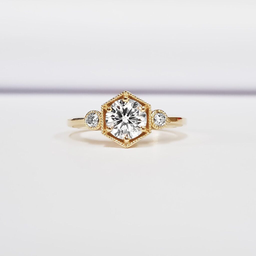 Moissanite three stone trilogy milgrain hexagon engagement ring  product image