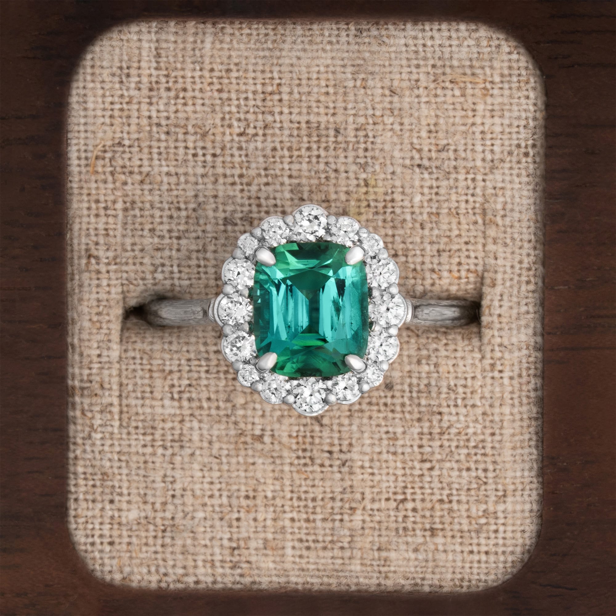 Cushion lagoon tourmaline and diamond halo ring