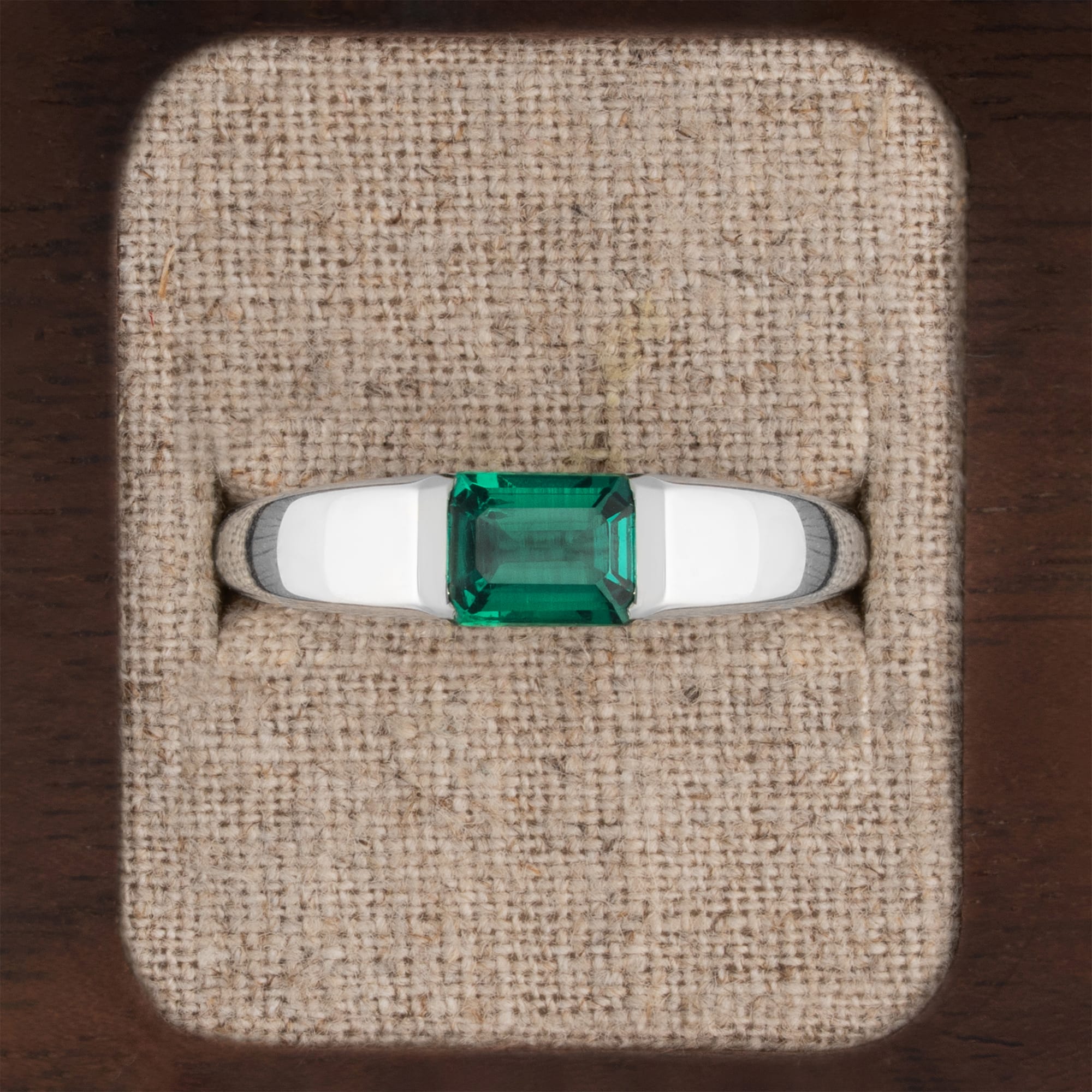 Channel set emerald tapered band ring 
