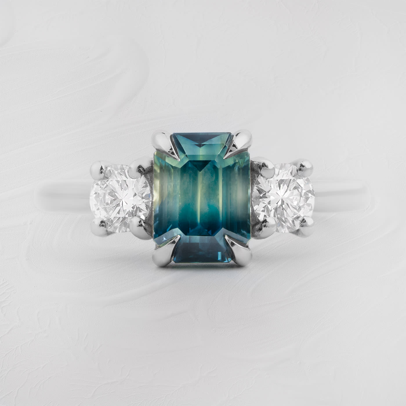 Bi colour emerald cut sapphire and diamond ring product image