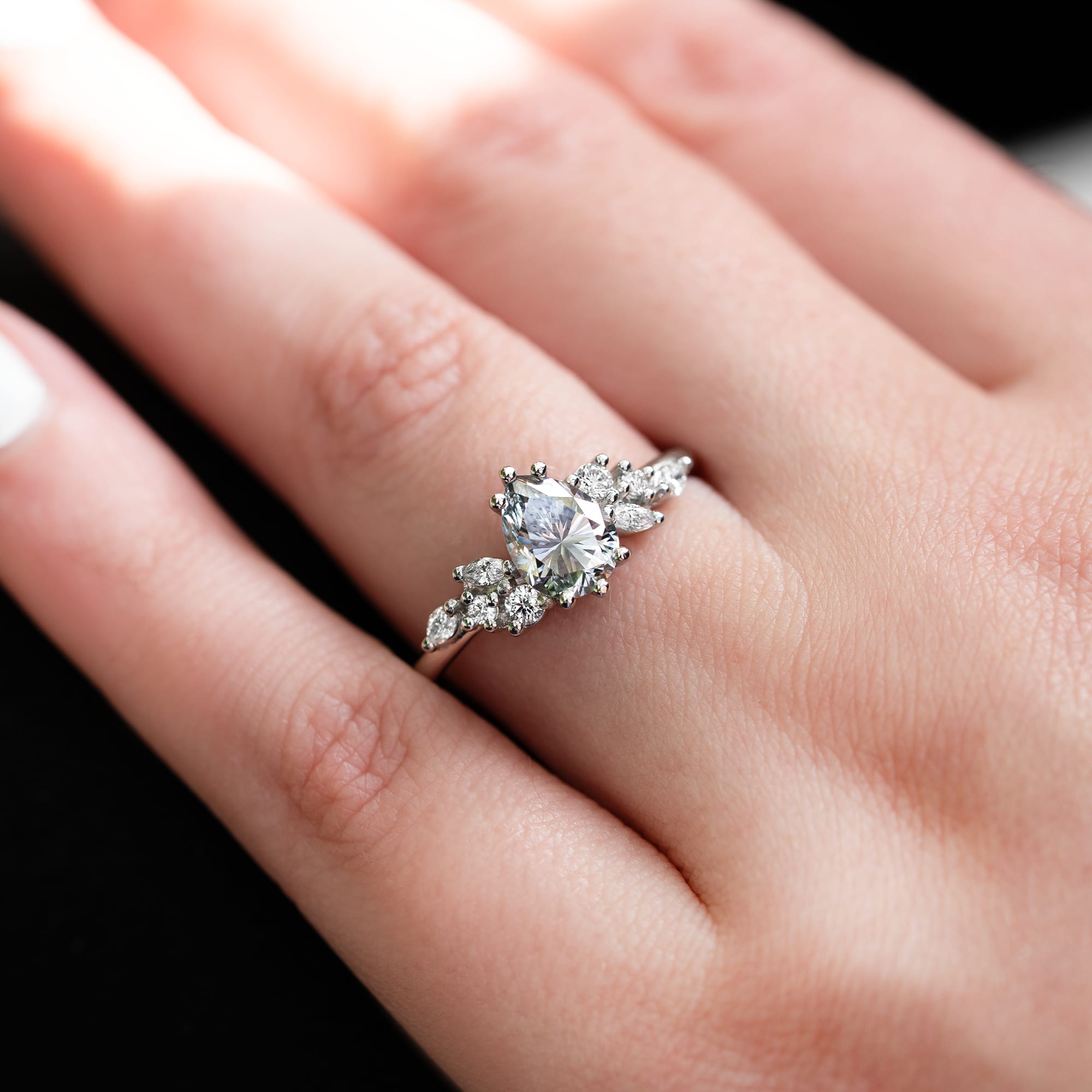 Light grey pear moissanite and diamond floral ring