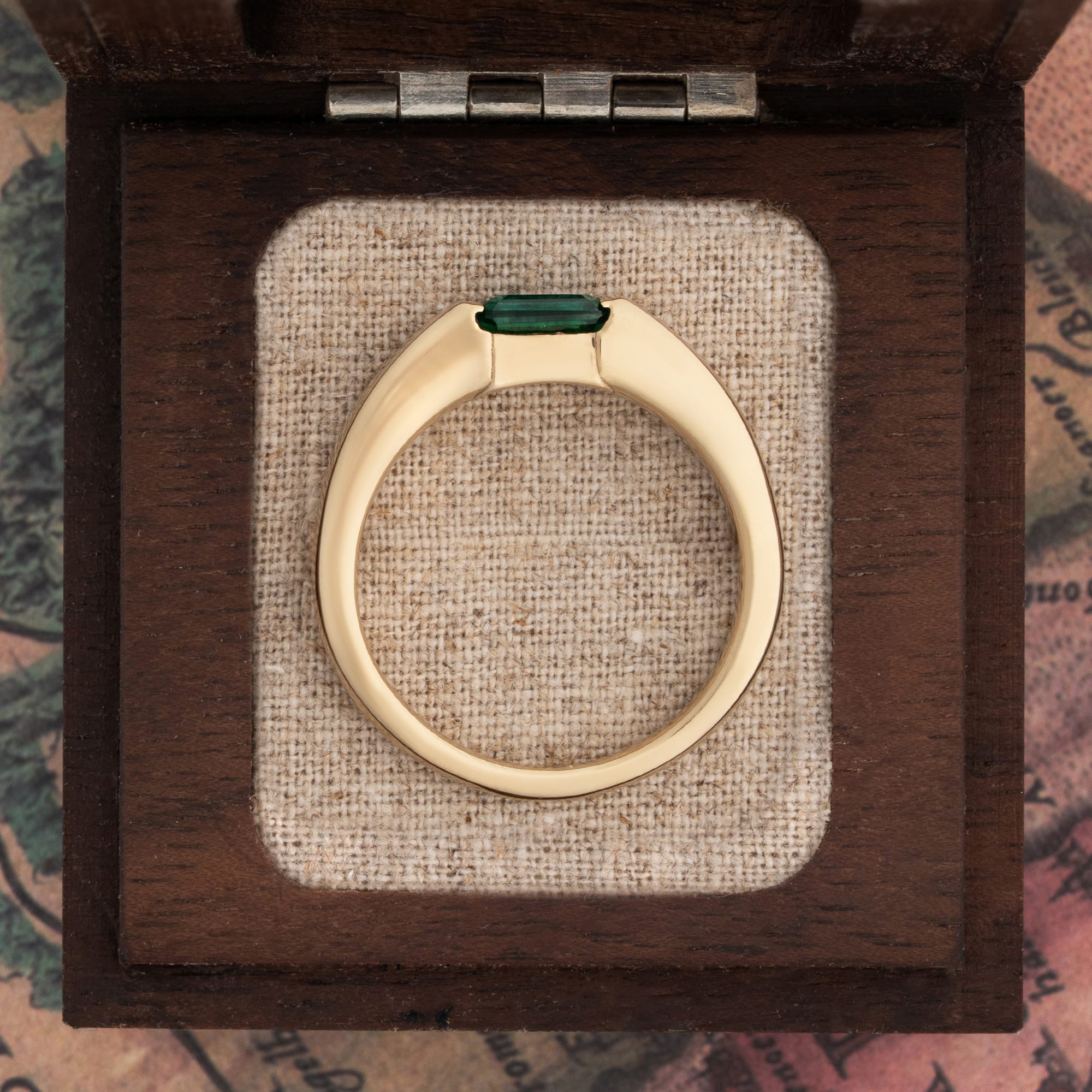 Channel set emerald tapered band — 4