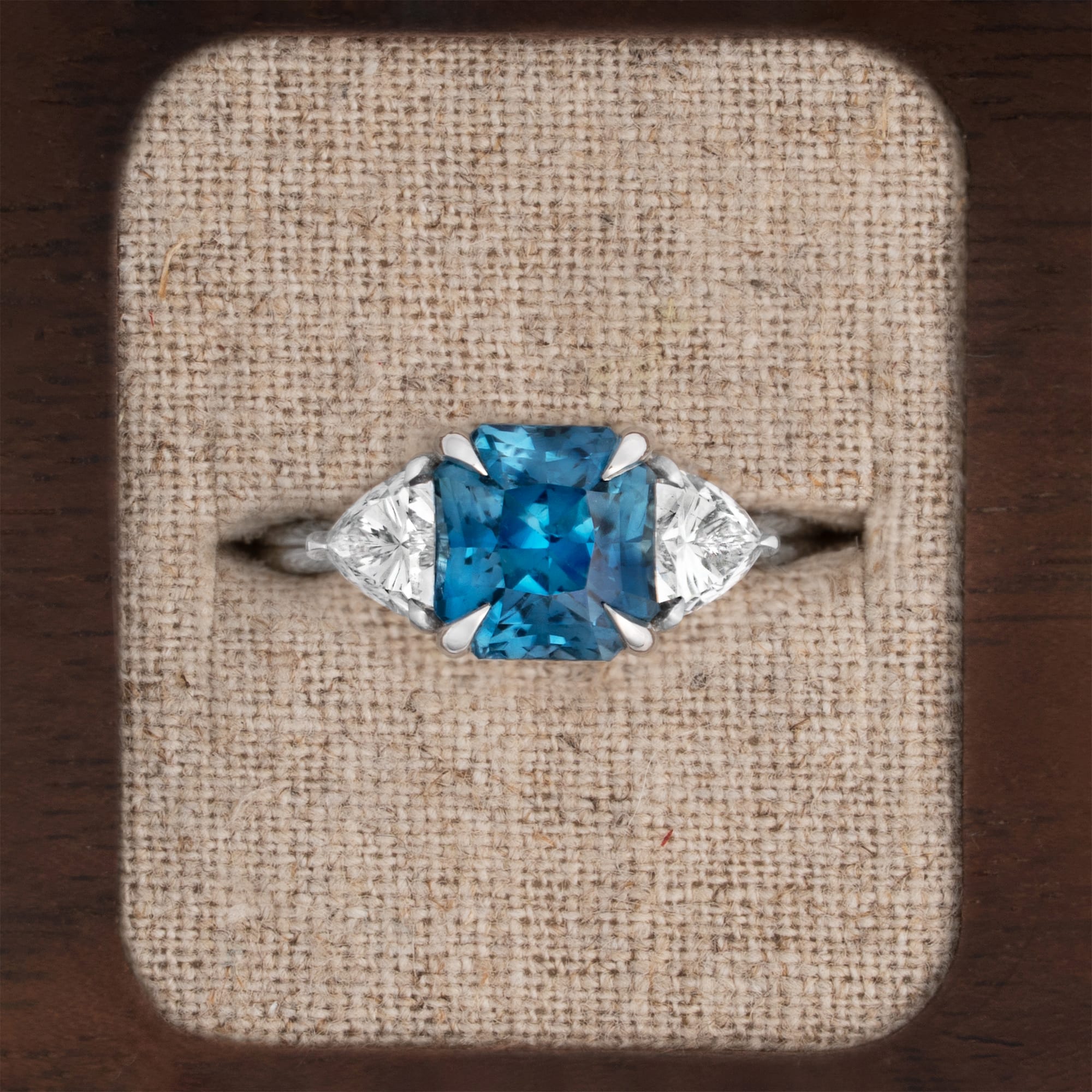 Radiant sapphire and trillion diamond ring
