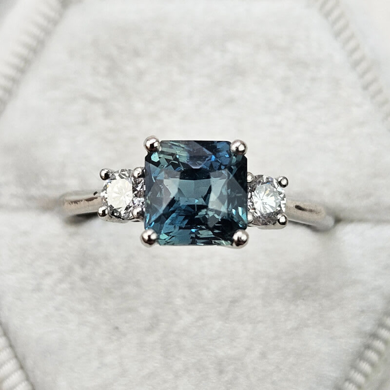 Radiant cut teal sapphire and diamond trilogy ring product image