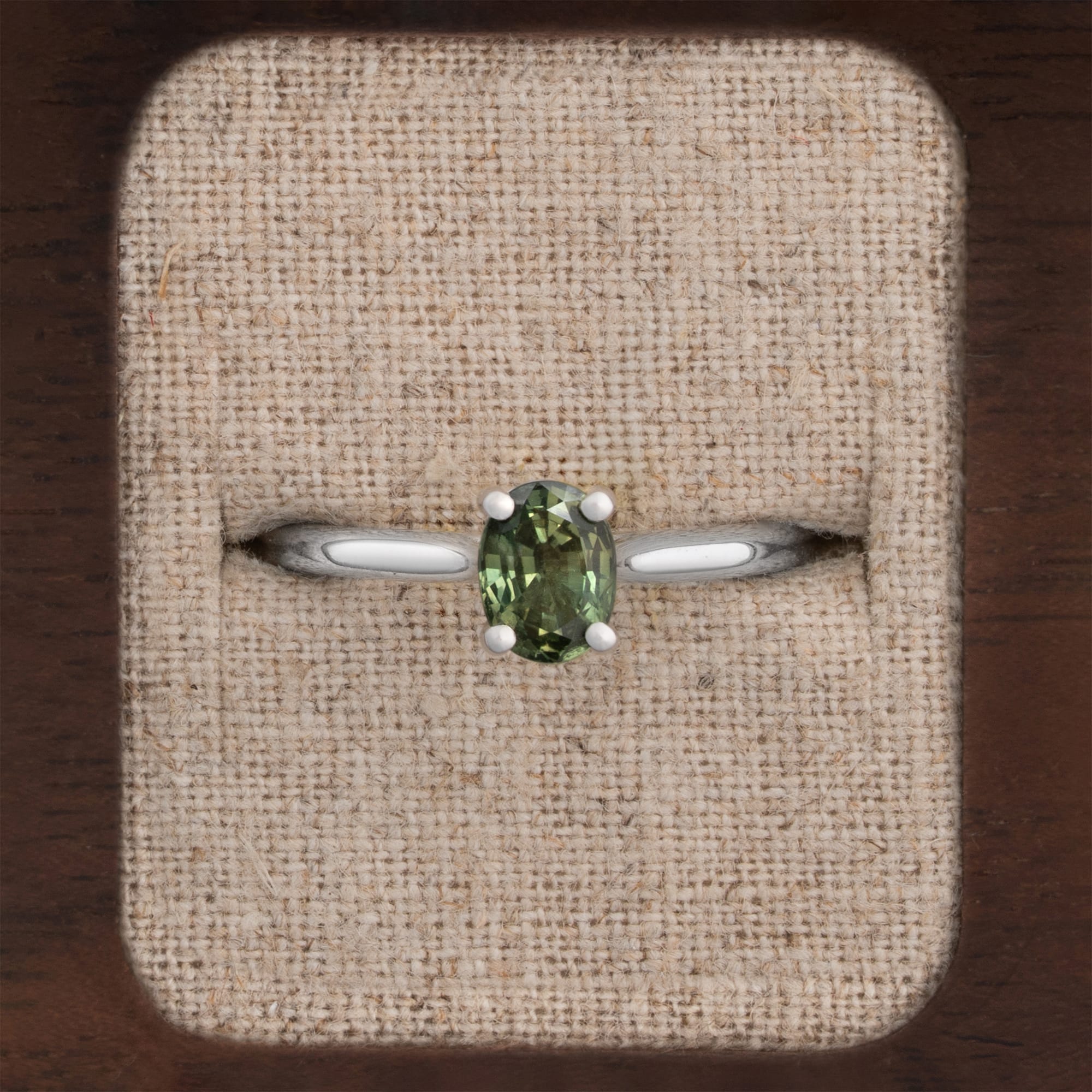 Oval cut green sapphire solitaire ring