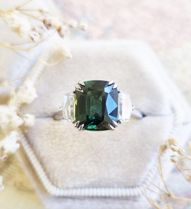Cushion cut forest green sapphire and diamond trilogy ring