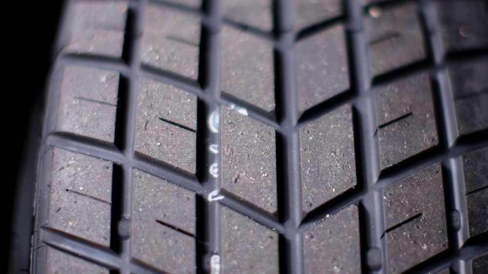 The blue-walled wet tyres have grooves to disperse water from the track surface