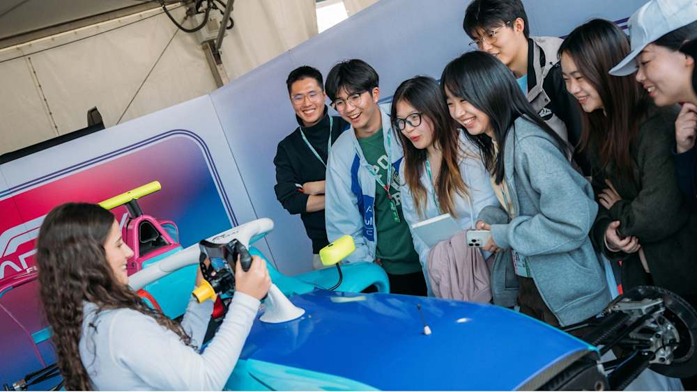 Ciconte explains her steering wheel to local Shanghai students