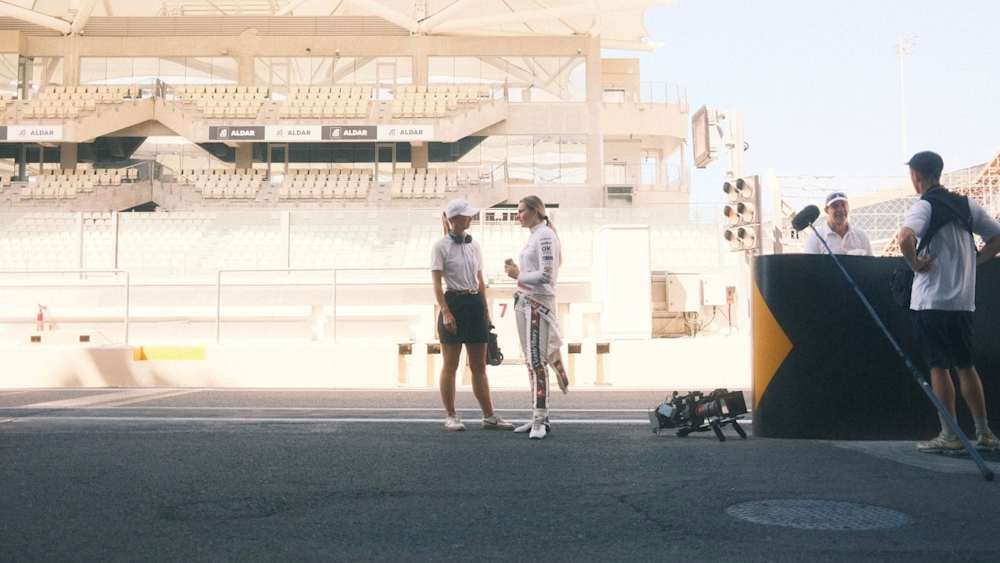 Lola Lovinfosse catches up with showrunner Lisa Keane at the Yas Marina Circuit | Credit @billmerner