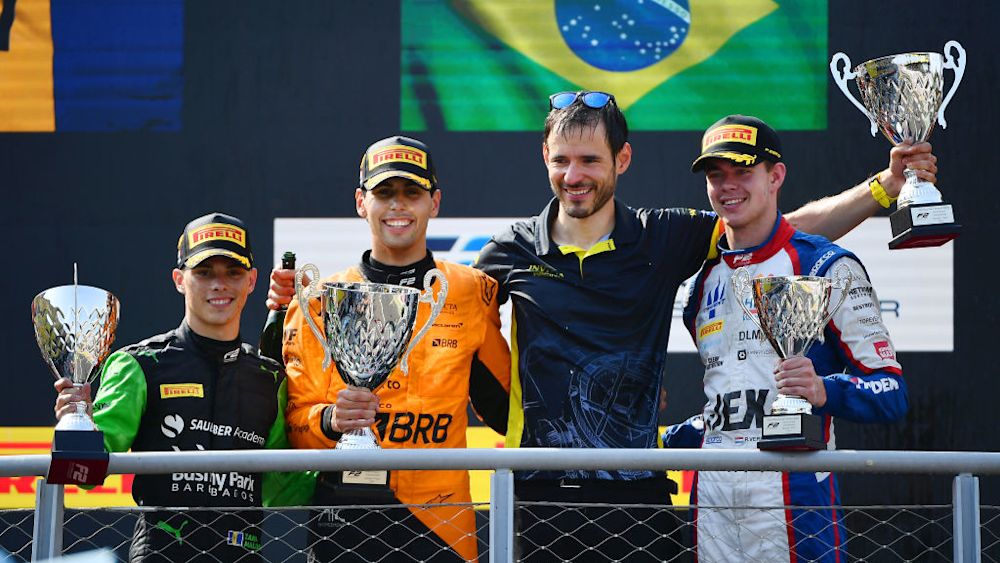 The top three of Bortoleto Maloney and Verschoor celebrate on the podium