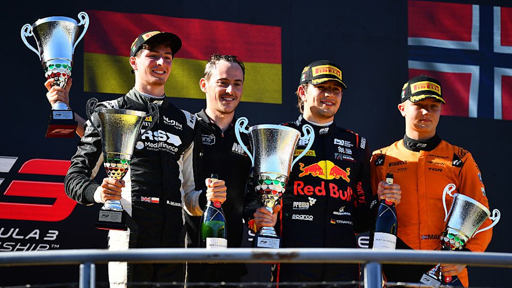 The top celebrate on the podium after the Sprint Race