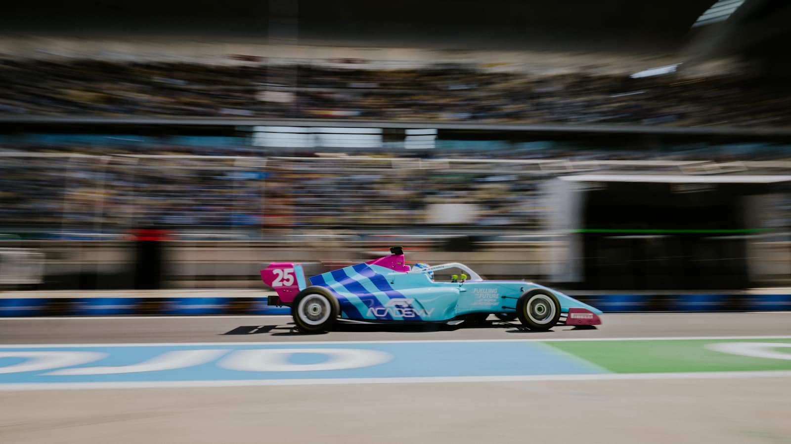 F1 Academy car driving down the pitlane