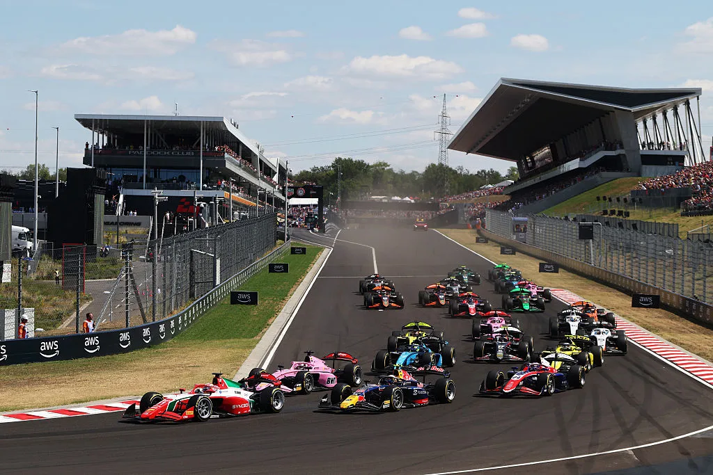 Formula 2 cars race through Turn 1 during the 2026 Budapest Sprint Race