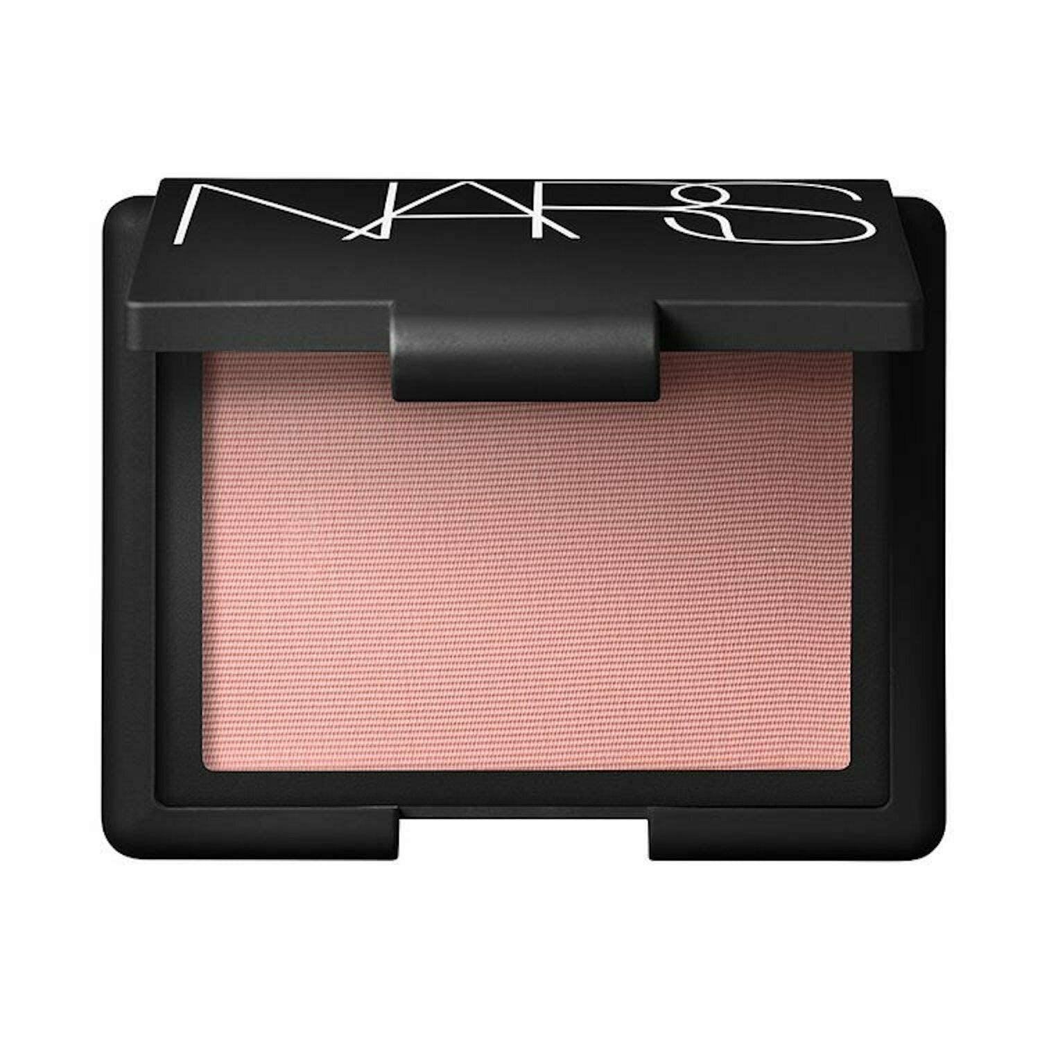 NARS powder blush in a soft pink shade, shown in a sleek black compact with a subtle embossed texture, designed to add a natural flush to the cheeks.