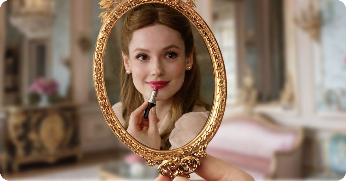 Reflection of a woman applying red lipstick in an ornate gold handheld mirror, set in an elegant, softly lit interior with a classic, romantic atmosphere.