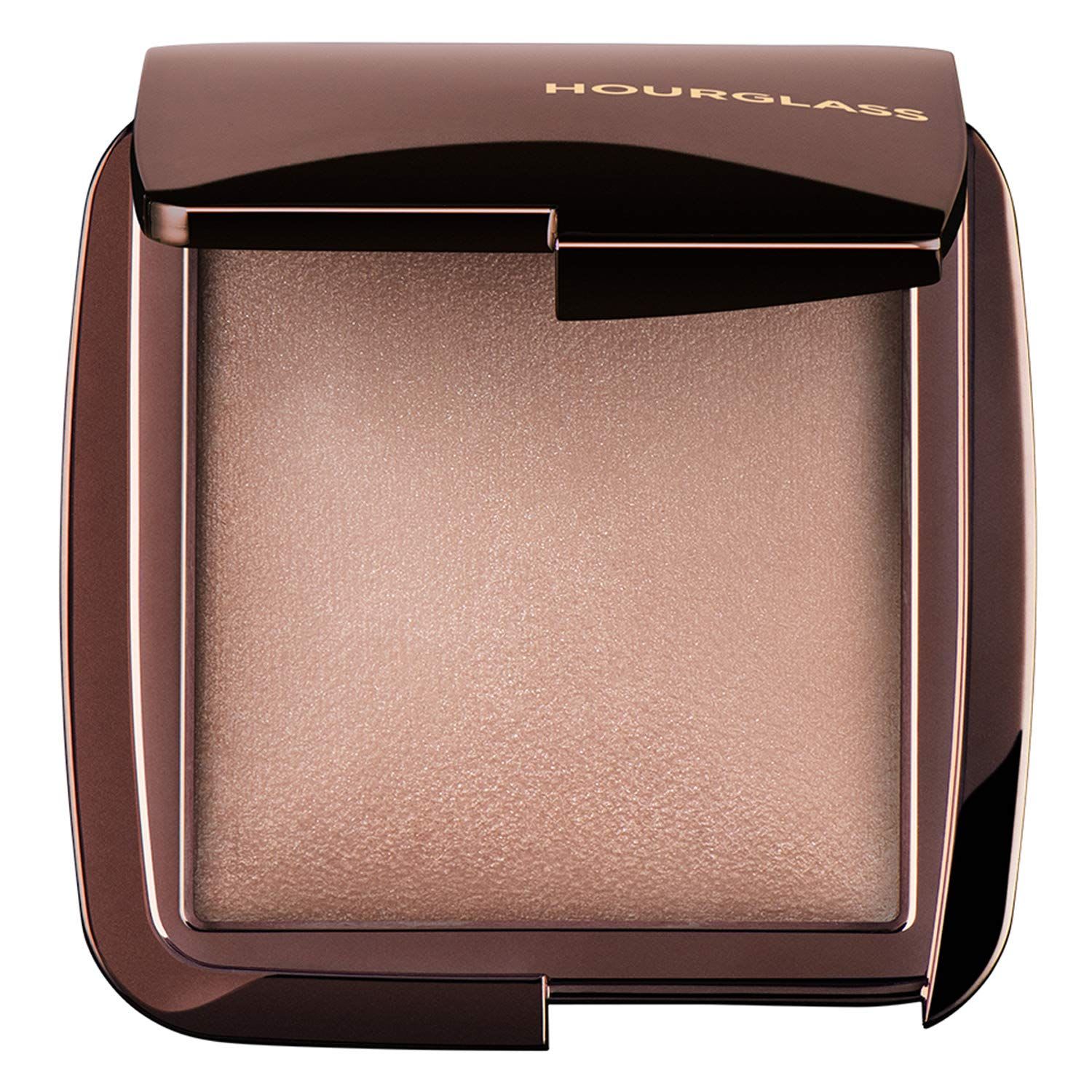 Hourglass Ambient Lighting Powder, shown in a sleek metallic compact with a soft luminous beige powder, displayed against a clean background.
