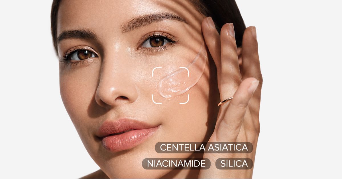 Woman applying a gel sunscreen to her cheek, with key ingredients labeled: centella asiatica, niacinamide, and silica.