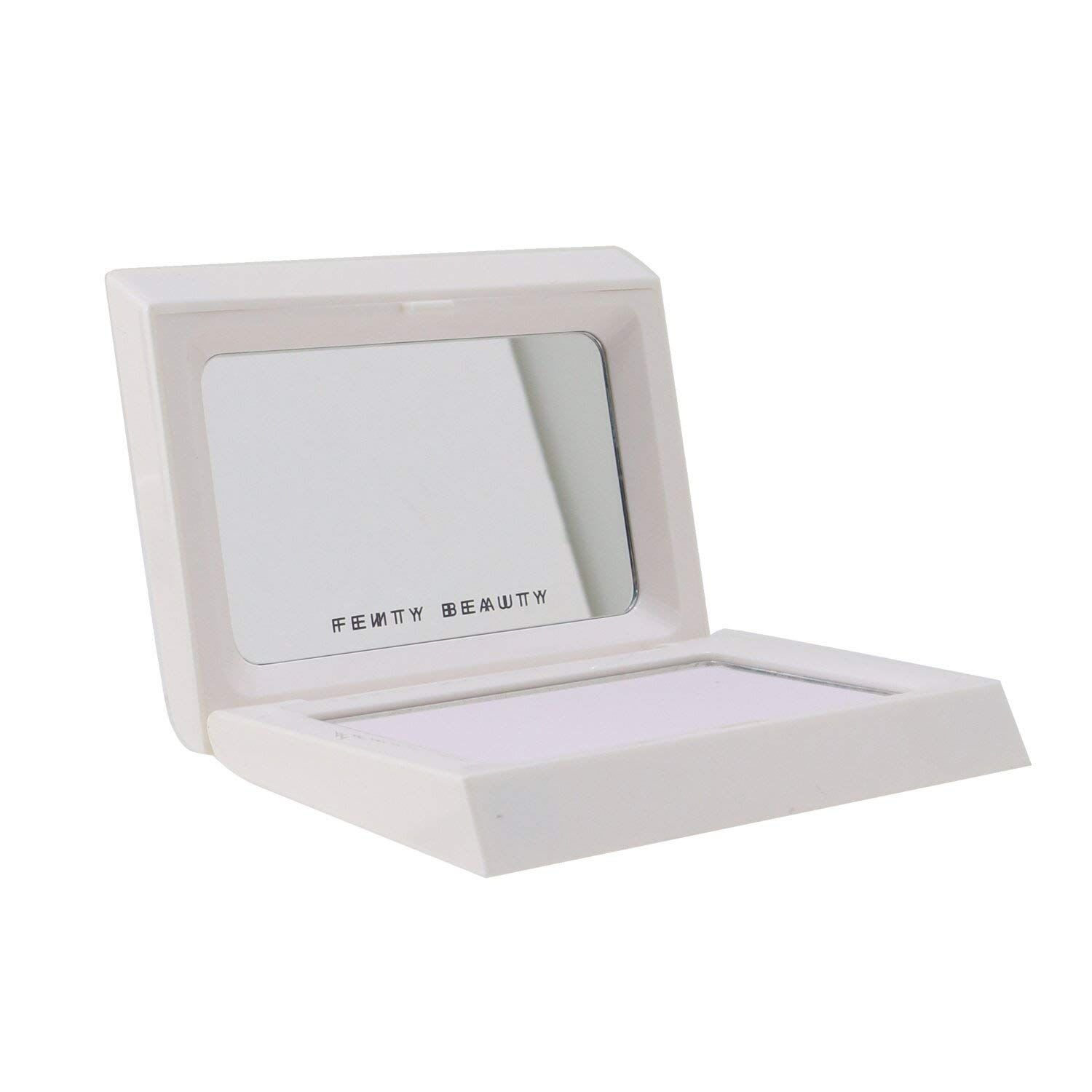 Fenty Beauty Invisimatte Blotting Powder compact, open, showing a translucent white pressed powder and a built-in mirror.