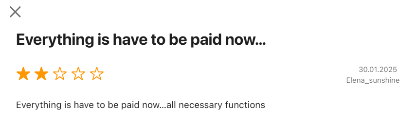 A 2-star user review complaining that everything in the YouCam app now requires payment.