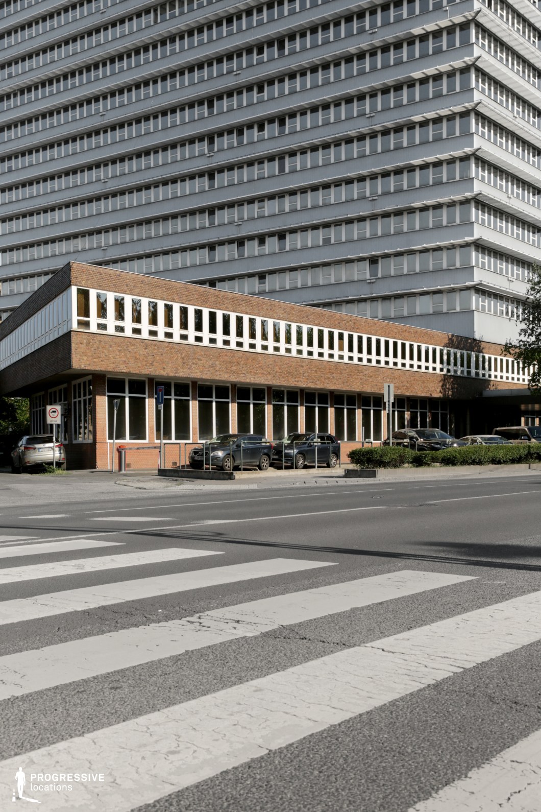 This is a striking socialist-era building with a sharp contrast between its modernist lower structure and the towering upper floors. 