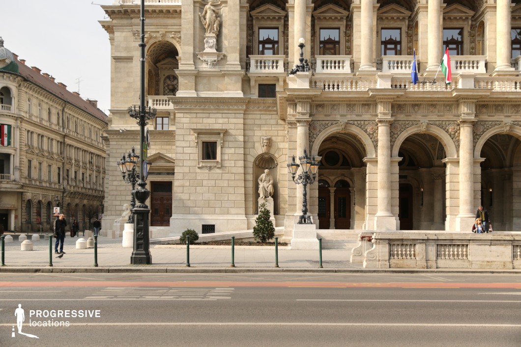 This is the grand façade of a Neo-Renaissance building, characterized by its ornate limestone detailing and classical architectural elements. 