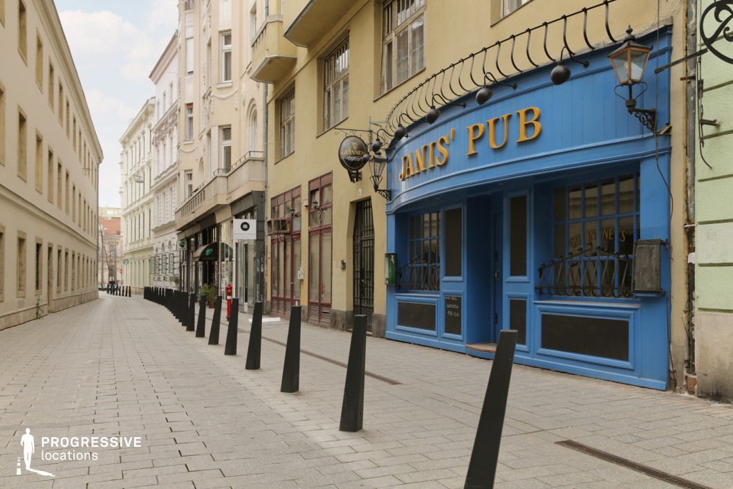 Blue pub facade along narrow street, an ideal location for photography and filming with strong color contrast and linear perspective