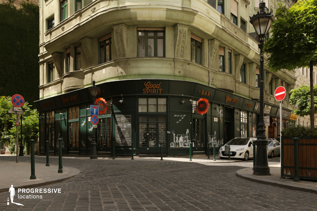 Corner bar building with curved facade, photography and film location with bold urban geometry and layered architecture