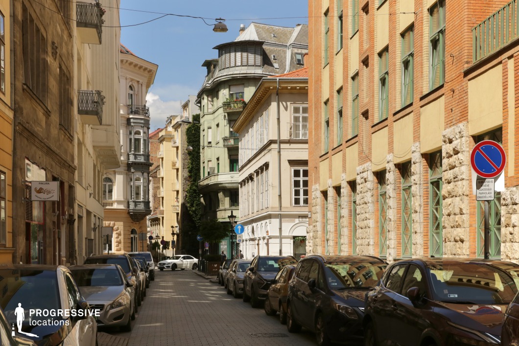 Historic street with mixed facades and strong perspective, used for photo and film shoots in a detailed urban environment