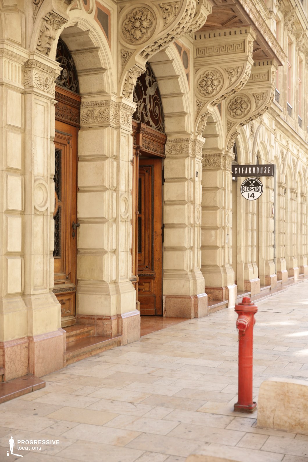 Ornate arched entrances with carved stone details, ideal location for photography and filming with rich architectural texture