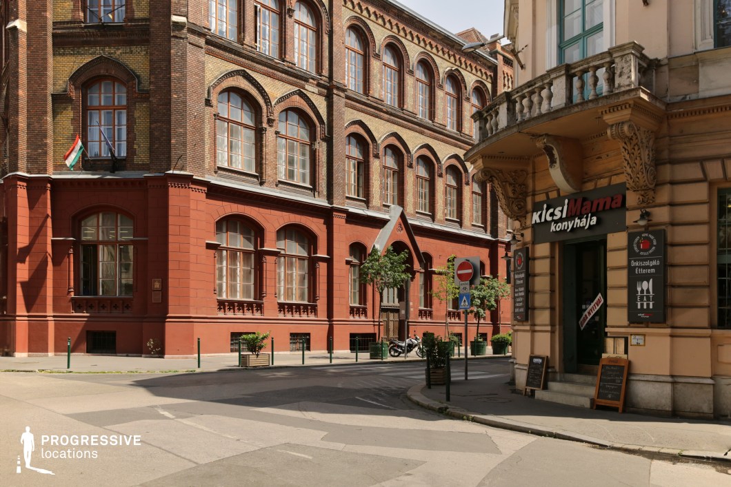 Historic street with detailed facades and corner storefront suitable for film and photography location use