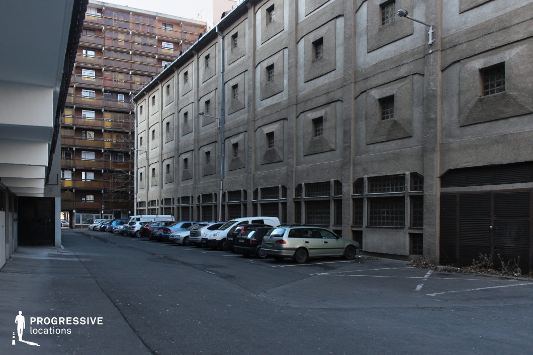 Long residential backstreet with contrasting facades, ideal location for photography and filming with strong linear perspective
