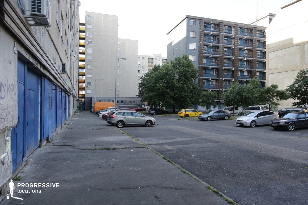Open urban courtyard with mixed residential buildings, film and photography location offering wide flexible shooting space