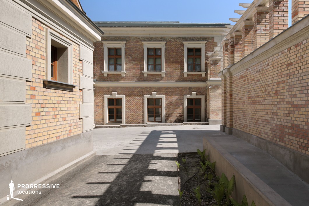Brick courtyard with windows serves as a film and photography location with clean lines and structured architectural layout